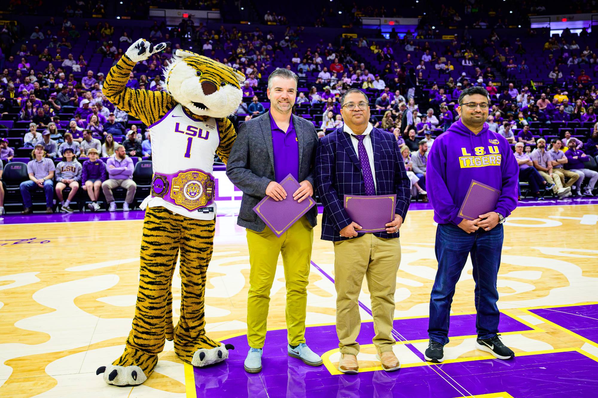 Members of the DeepFire team were honored at a Men's Basketball game